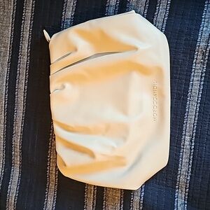 NEW Moroccanoil cosmetic bag.PU leather,bage color,very soft.